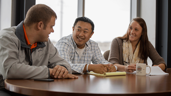 Conference Room Discussion Between Collegues